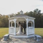 couple getting married in a gazebo