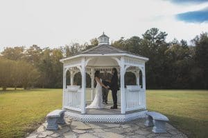 couple getting married in a gazebo