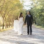 wedding couple walking during fall
