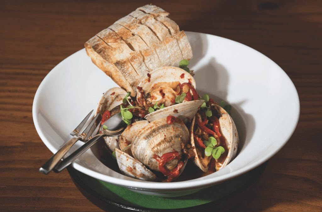 dish by Adrift with clams and bread