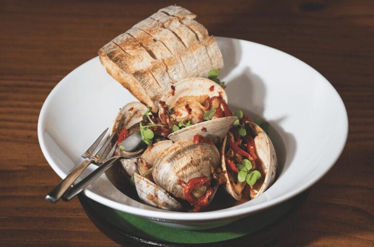 dish by Adrift with clams and bread