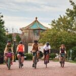 FREE WHEELING Cyclists in front of The Pagoda on the Elizabeth River Trail