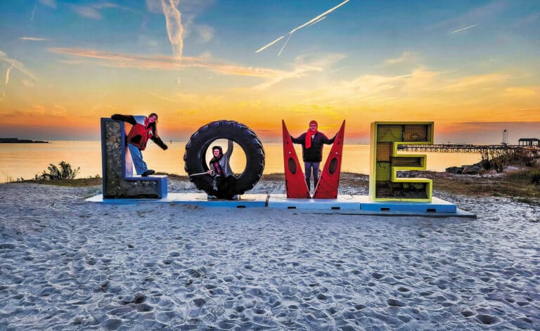 People at the Cape Charles Love sign