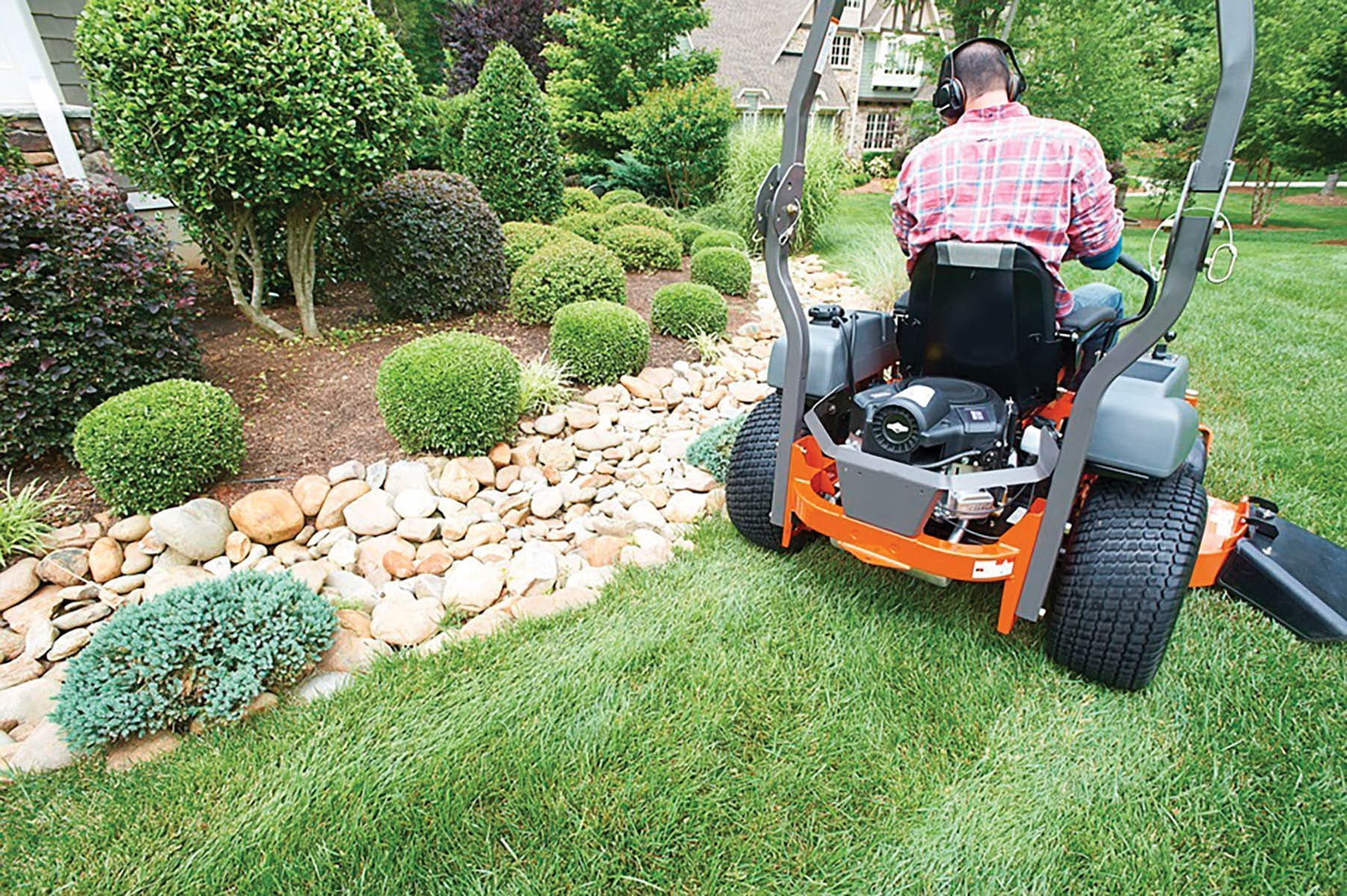 Guy mowing the lawn