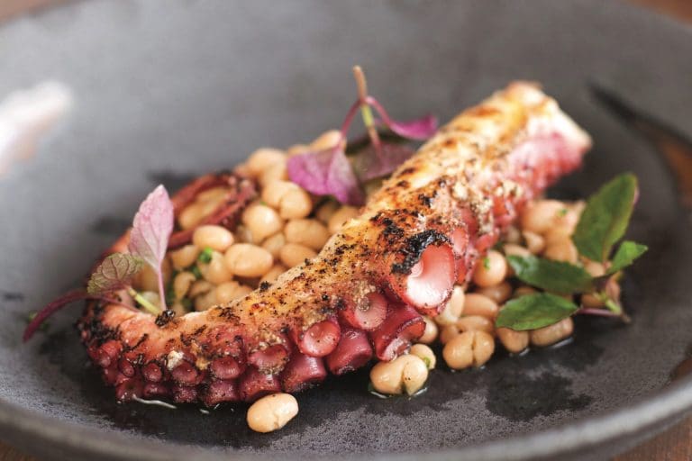 Spanish octopus with marinated white beans and shiso.